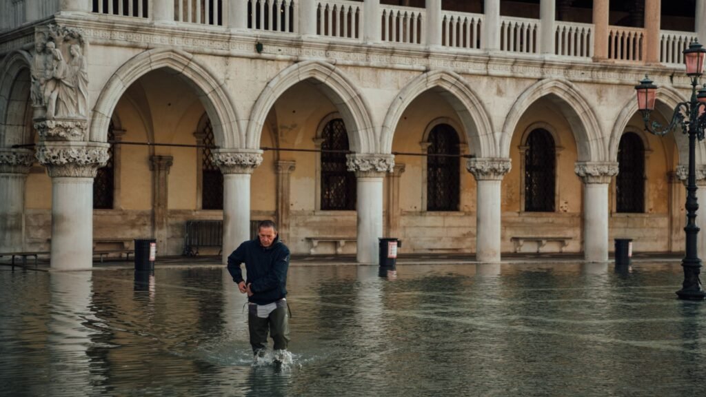 Man Walking in Flooded Venice