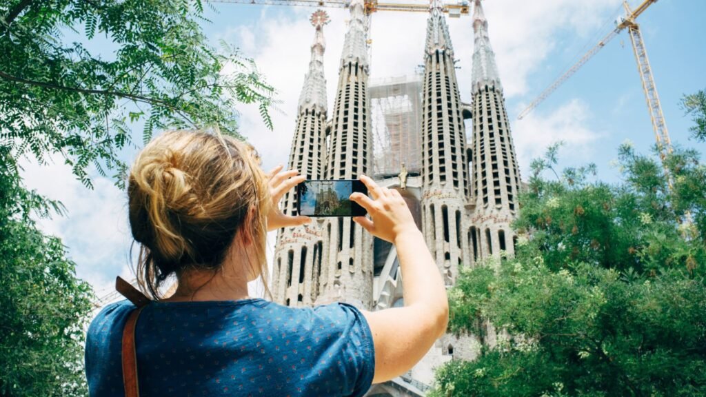 Tourst Taking a Photo of Sagrada Familia